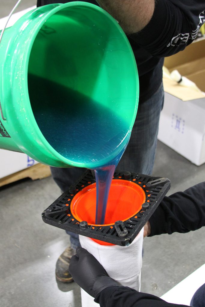 Pouring resin into liner